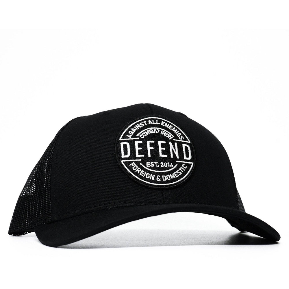 A black mid-profile mesh snapback with a patch saying “Defend against all enemies foreign and domestic” in white letters #color_black-black