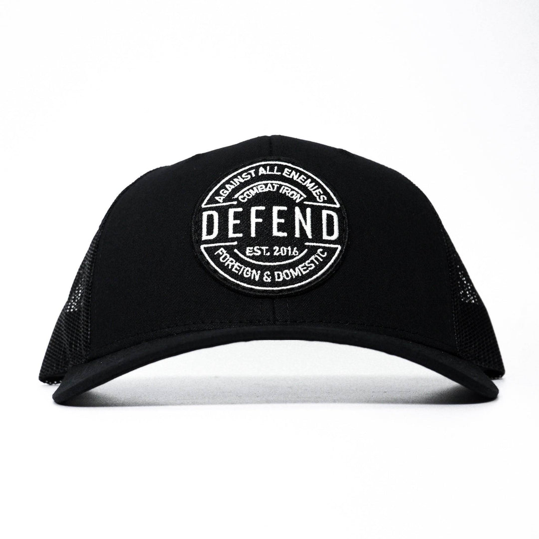 A black mid-profile mesh snapback with a patch saying “Defend against all enemies foreign and domestic” in white letters #color_black-black