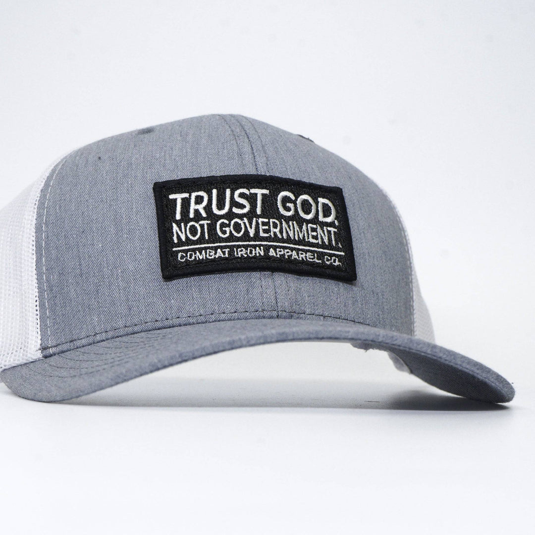 A mid-profile mesh snapback with the words “Trust God. Not government.” in white on the front #color_gray-white