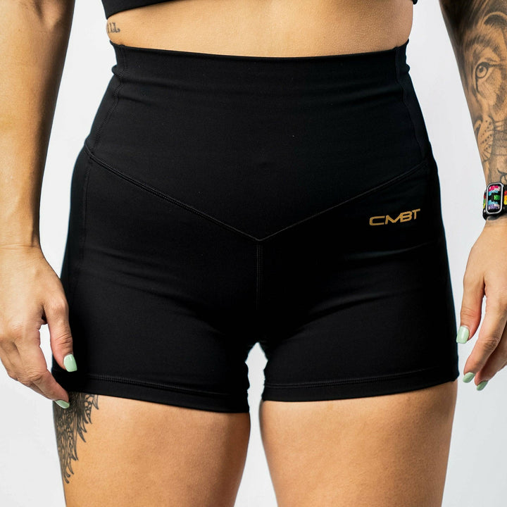 Ladies' luxe high-waisted shorts for women, all black with the CMBT logo #color_black