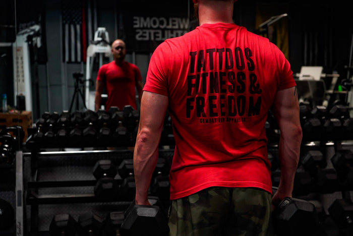 Man in gym with workout shirt.