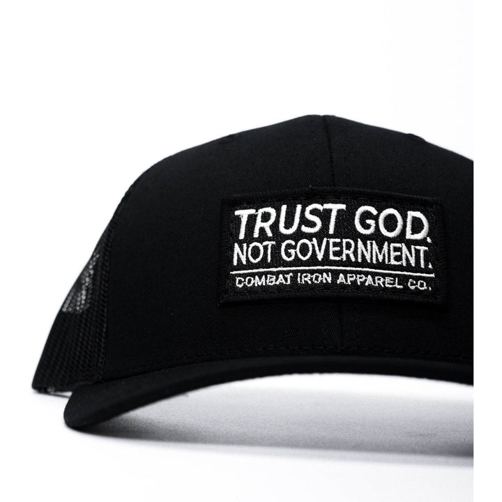 A black mid-profile mesh snapback with the words “Trust God. Not government.” in white on the front #color_black-black