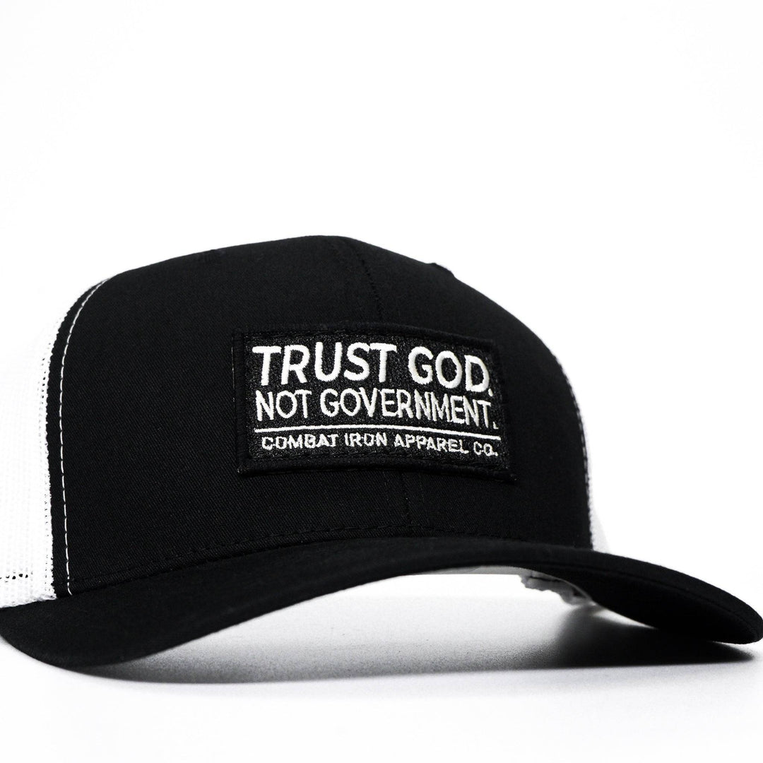 A black mid-profile mesh snapback with the words “Trust God. Not government.” in white on the front #color_black-white