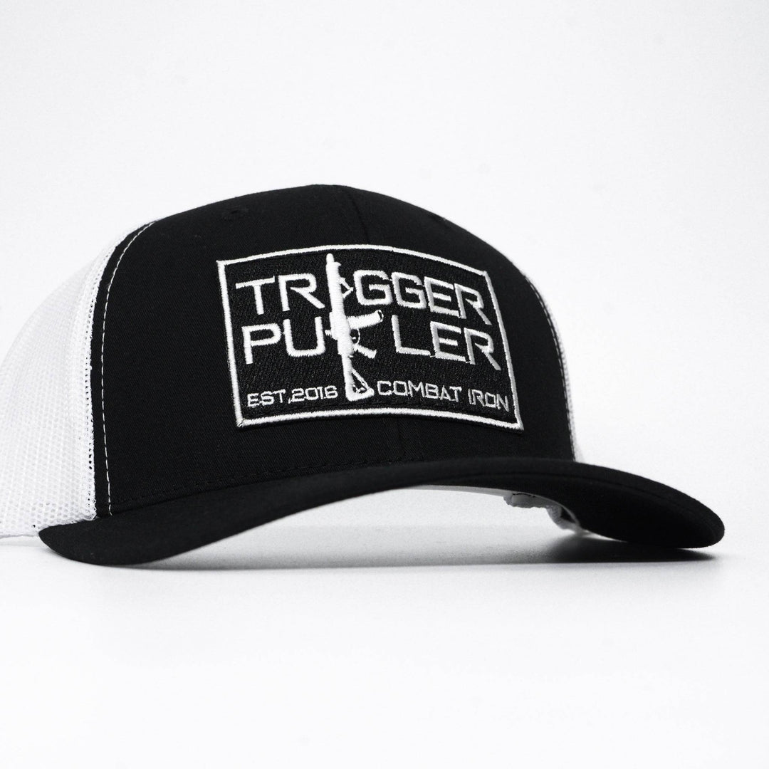 A mid-profile mesh snapback with the words “Trigger puller” on the front in white #color_black-white