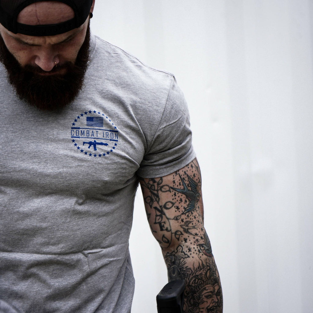 Men’s t-shirt with the words “Tattoos, fitness & freedom” in red, white, and blue on the front  #color_gray