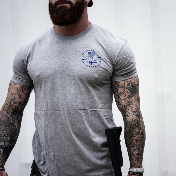 Men’s t-shirt with the words “Tattoos, fitness & freedom” in red, white, and blue on the front  #color_gray