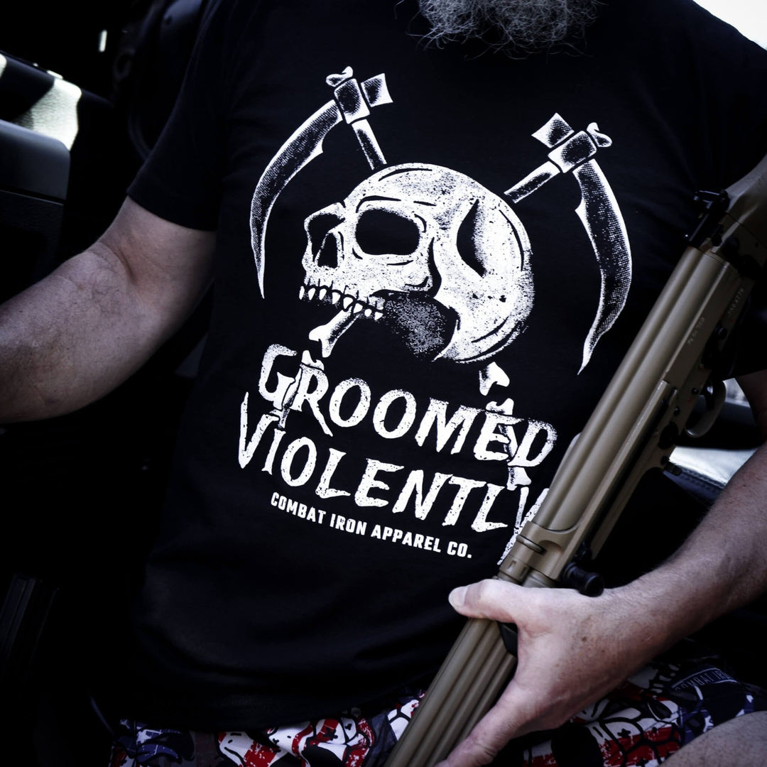 Men’s black t-shirt with the words “Groomed violently” with a skull and two sickles on the front #color_black