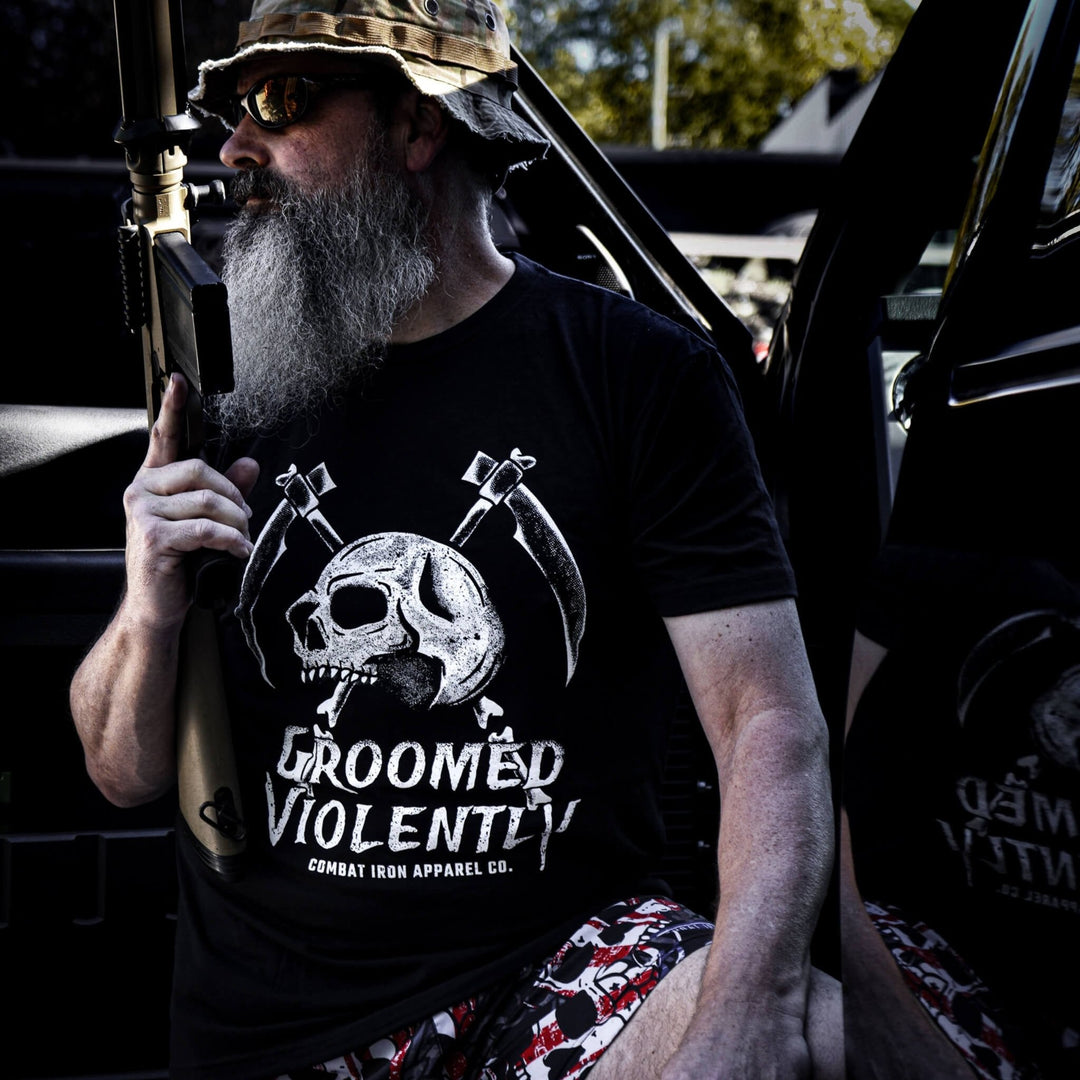 Men’s black t-shirt with the words “Groomed violently” with a skull and two sickles on the front #color_black