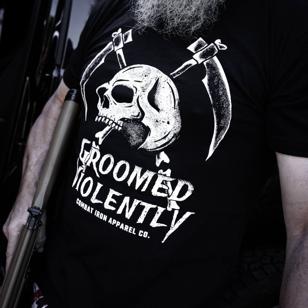 Men’s black t-shirt with the words “Groomed violently” with a skull and two sickles on the front #color_black