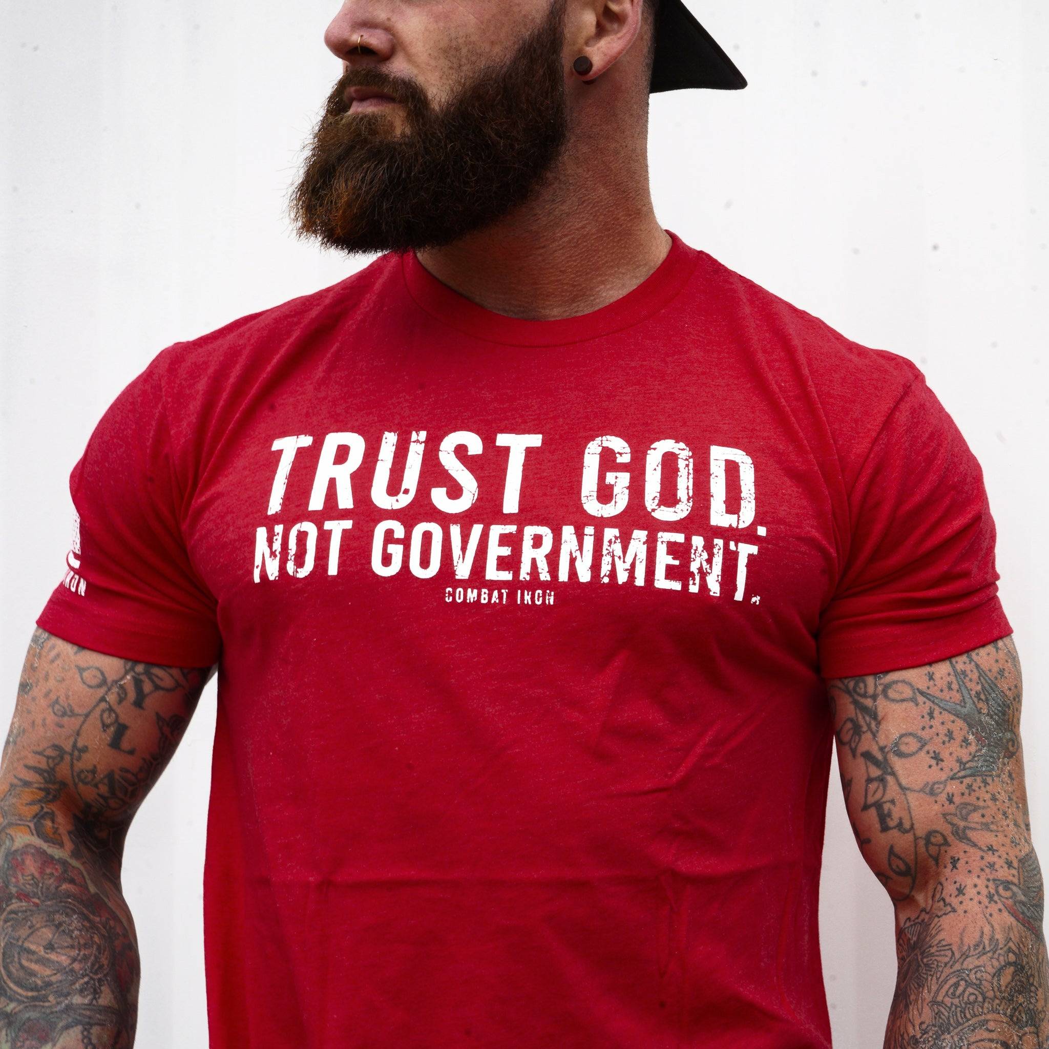 Men’s black t-shirt with the message “Trust God. Not government.” with letters and a American flag on the sleeve #color_red