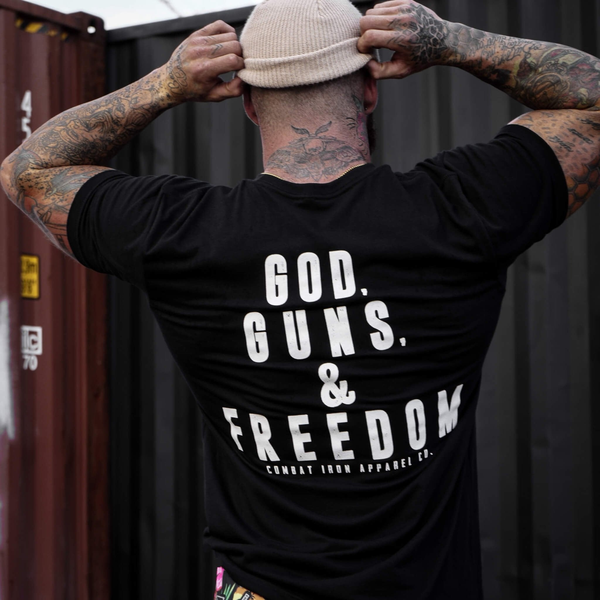 Men’s black t-shirt with the words “God, guns, & freedom” in white on the front #color_black