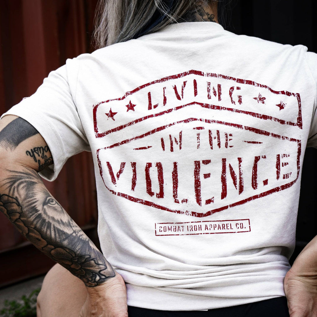 Men’s t-shirt with the words “Living in the violence” #color_tan