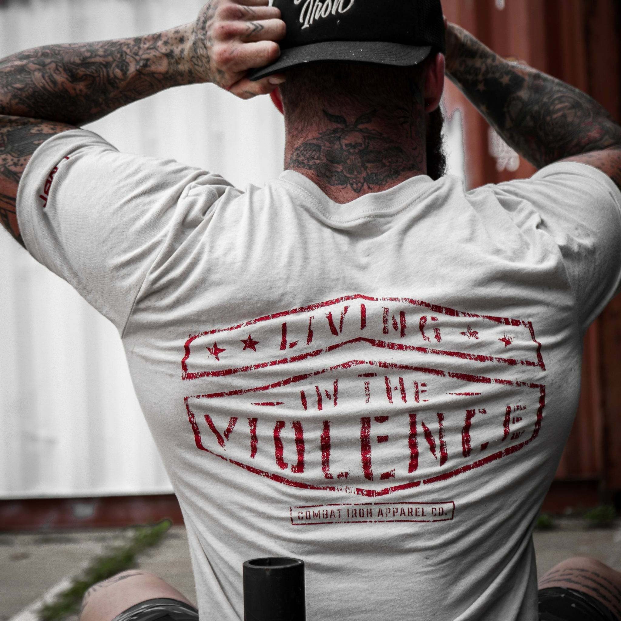 Men’s t-shirt with the words “Living in the violence” #color_tan