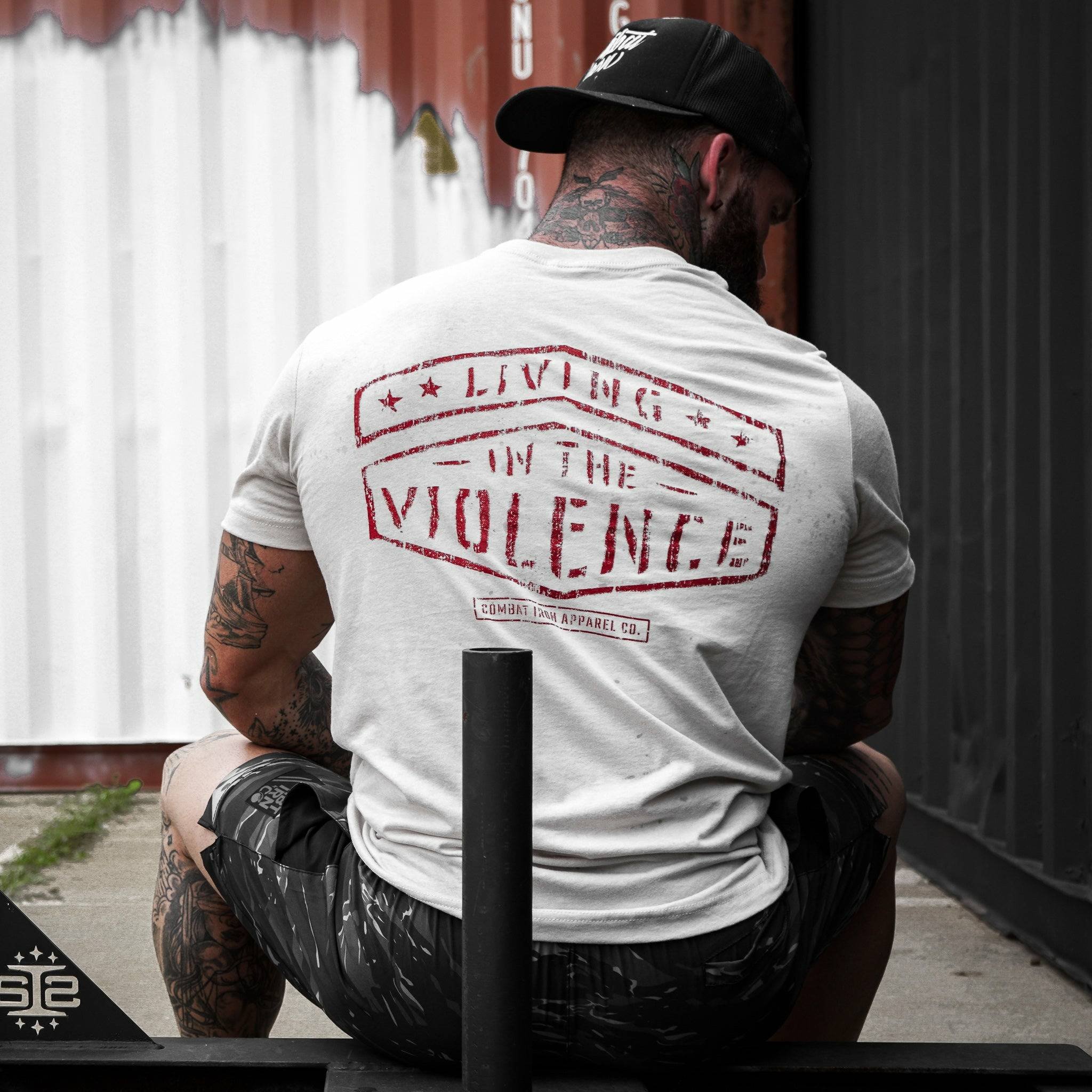 Men’s t-shirt with the words “Living in the violence” #color_tan