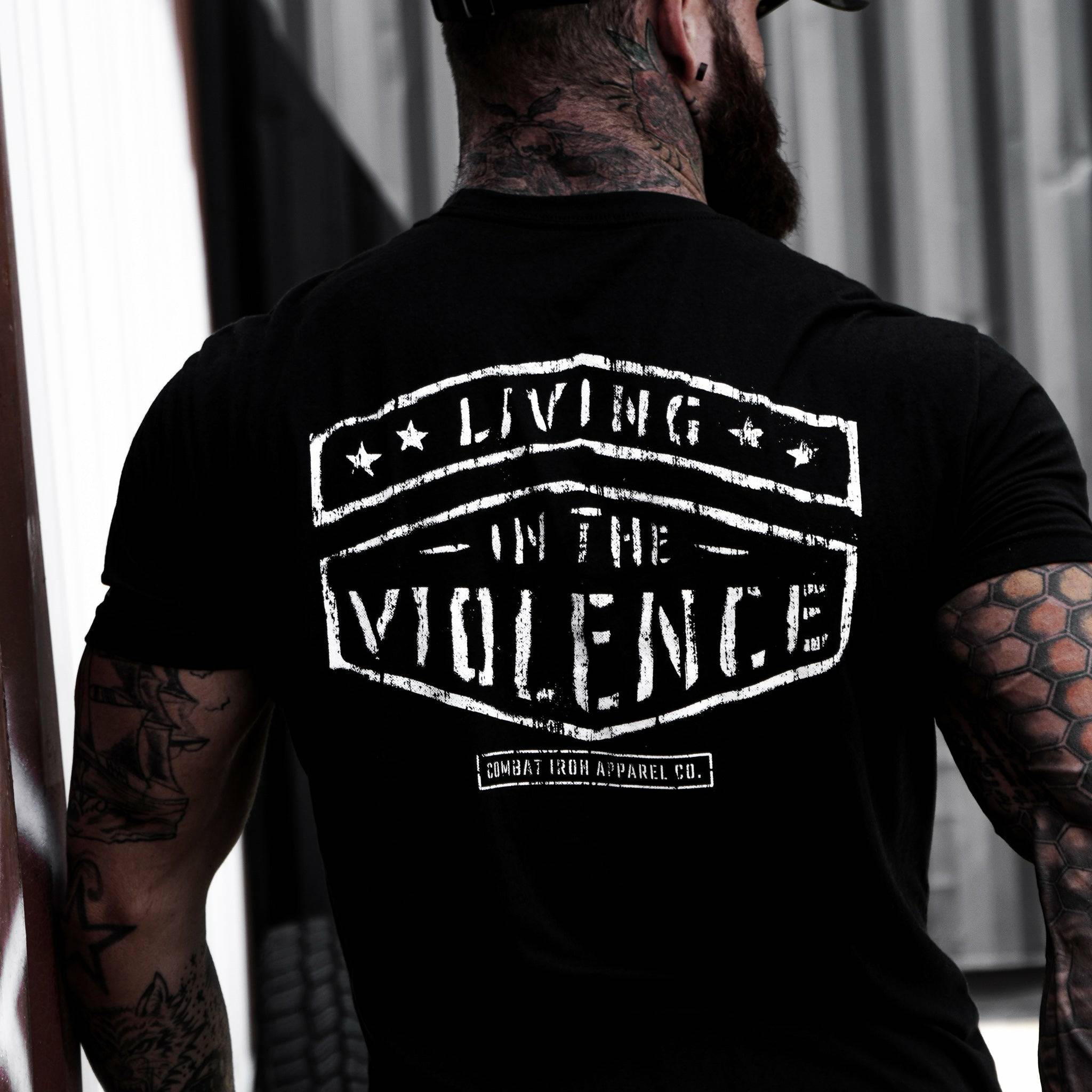 Men’s black t-shirt with the words “Living in the violence” #color_black