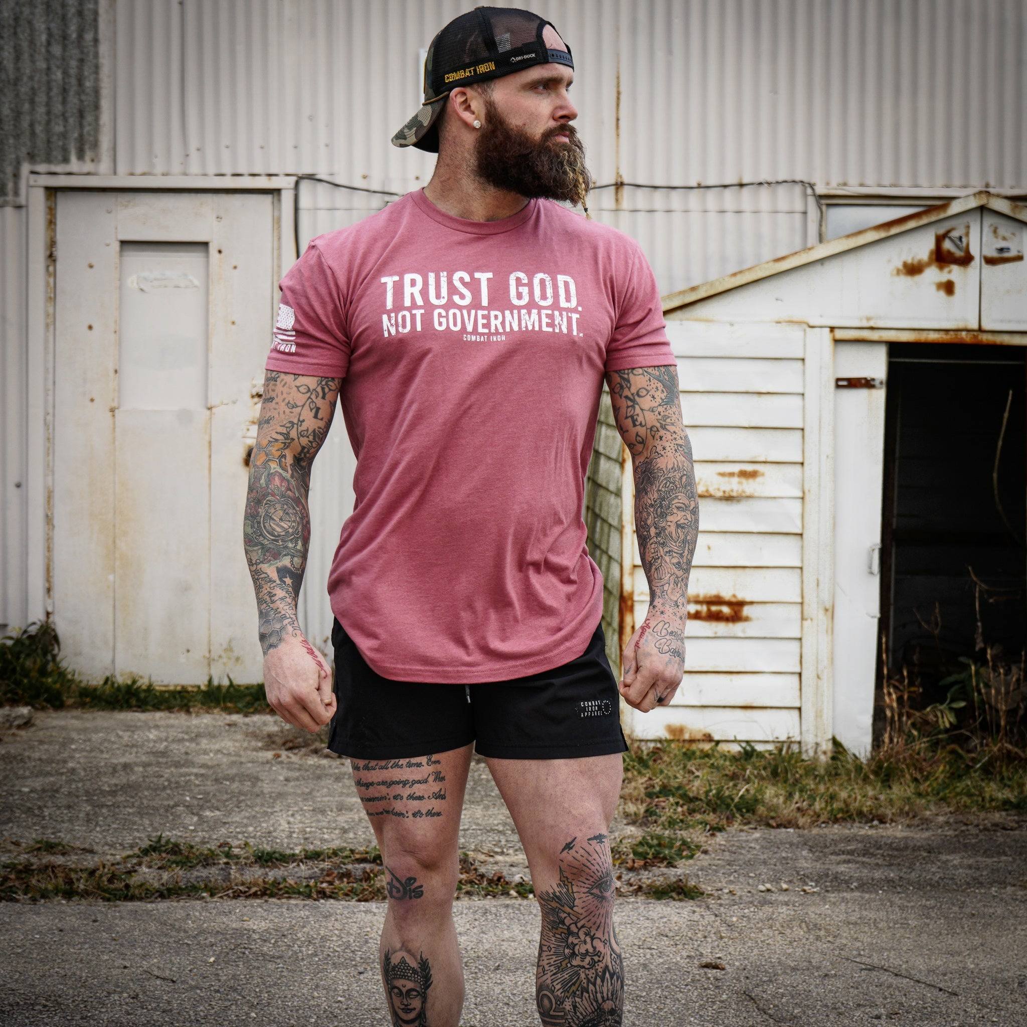 Men’s black t-shirt with the message “Trust God. Not government.” with letters and a American flag on the sleeve #color_muave