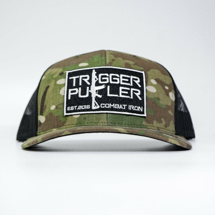 A mid-profile mesh snapback with the words “Trigger puller” on the front in white #color_multicam-black