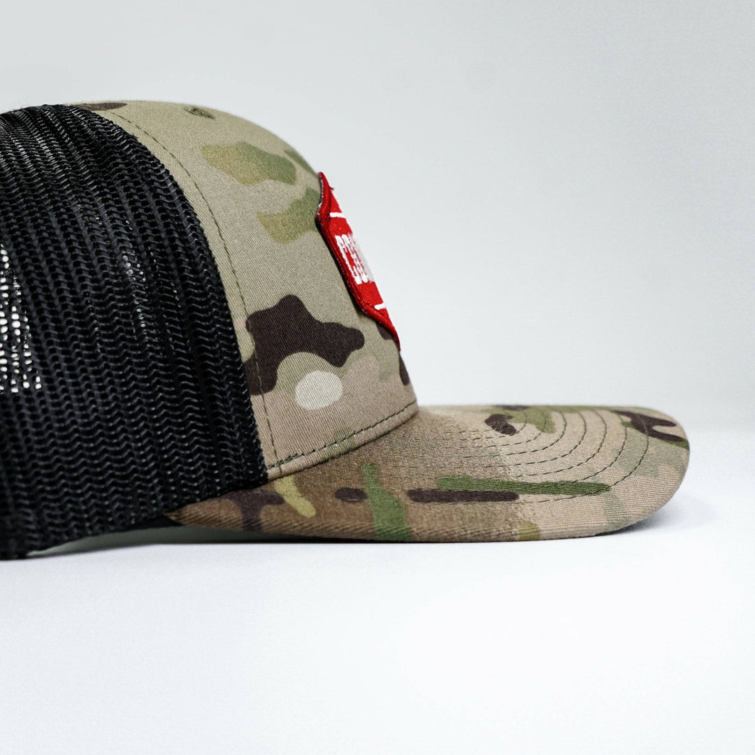 Combat branded patch mid-profile mesh snapback with a black and white patch on the front #color_multicam-black