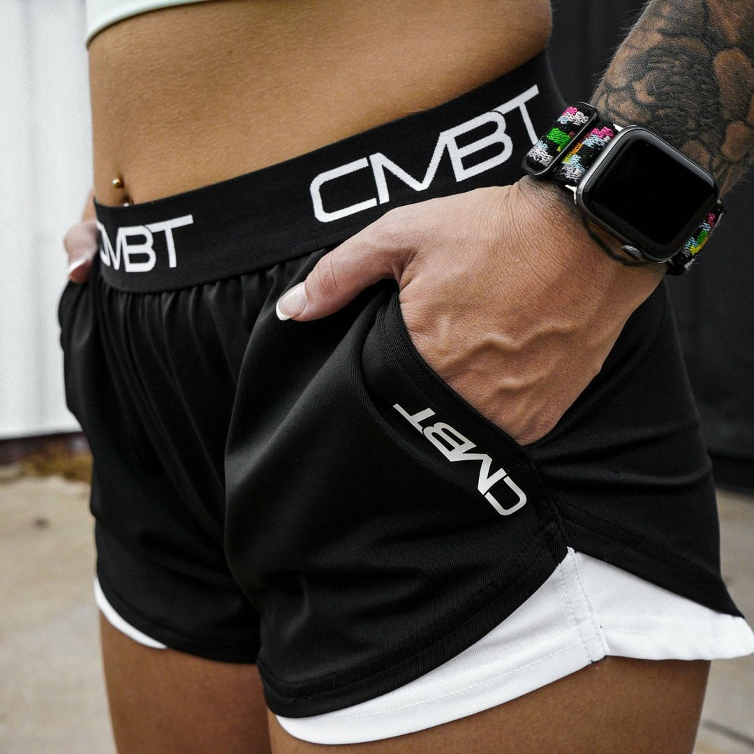 CMBT cross-training ladies’ shorts, all black with the CMBT logo in white #color_black