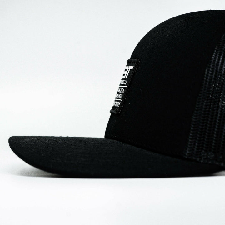 CMBT standard black woven patch mid-profile mesh snapback hat in black with a black and white patch on the front #color_black-black