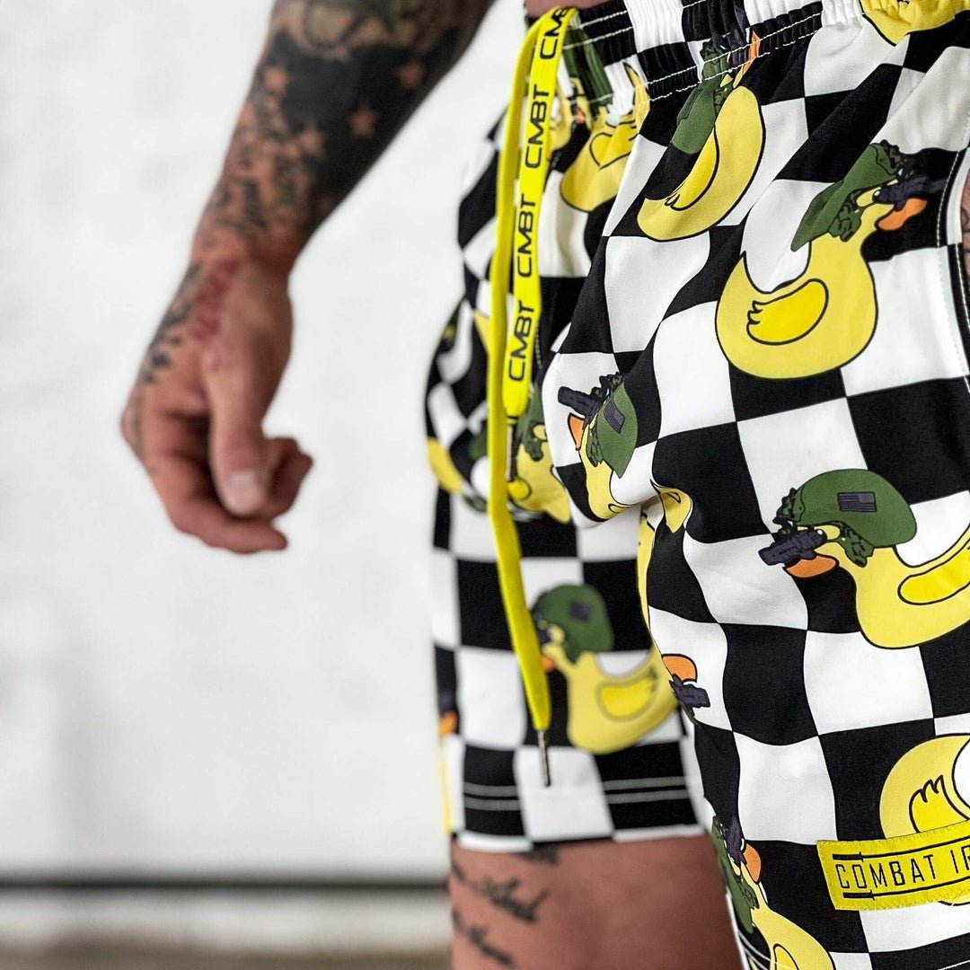 Men’s performance training shorts with black and white checkered design and ducks #color_tactiduck-checkered-edition