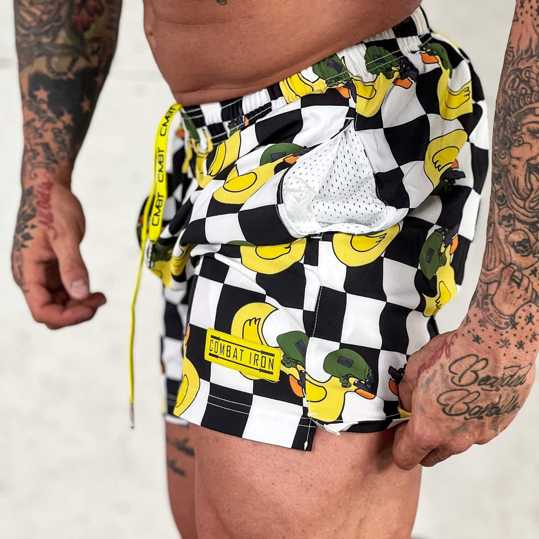 Men’s performance training shorts with black and white checkered design and ducks #color_tactiduck-checkered-edition