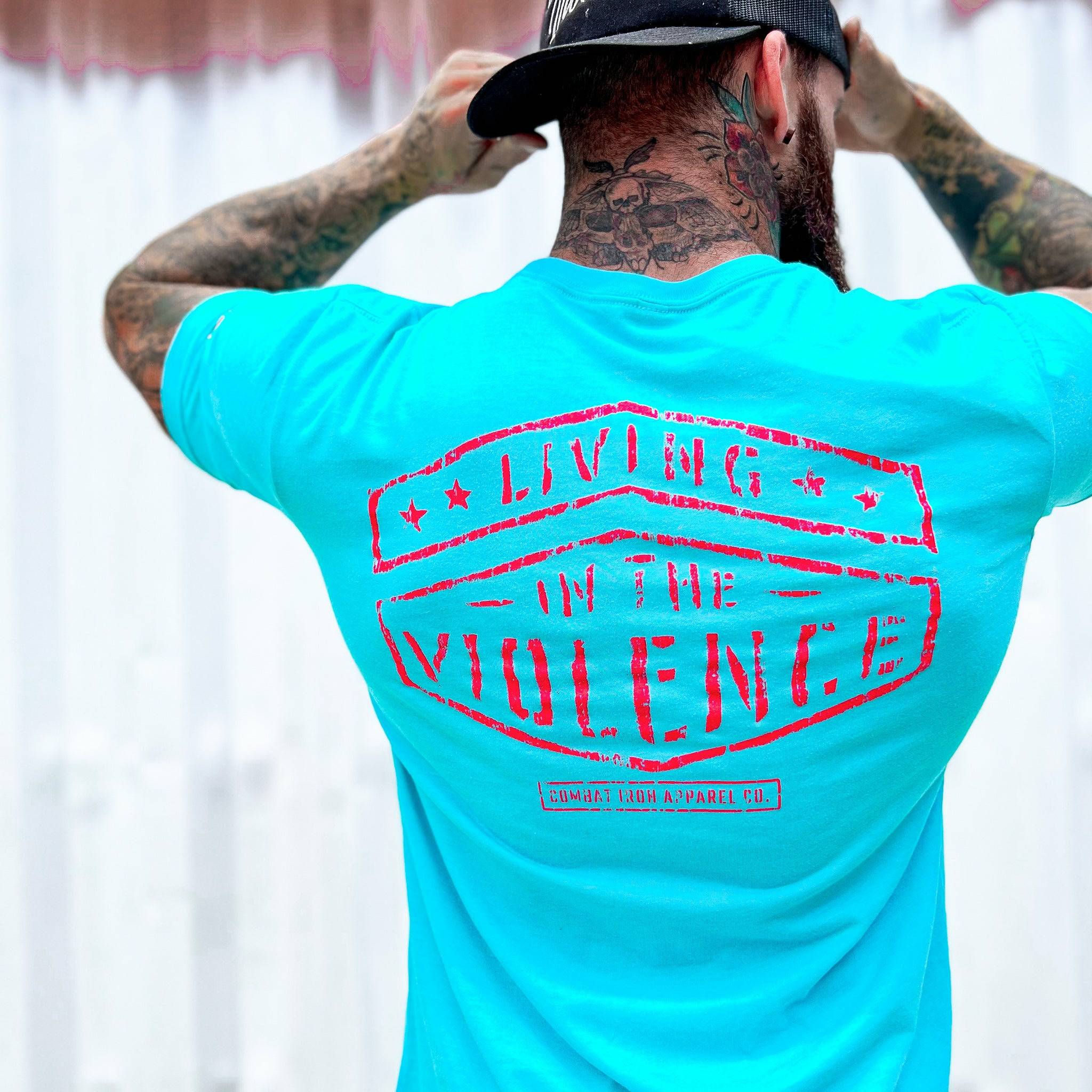 Men’s t-shirt with the words “Living in the violence” #color_tahiti-blue