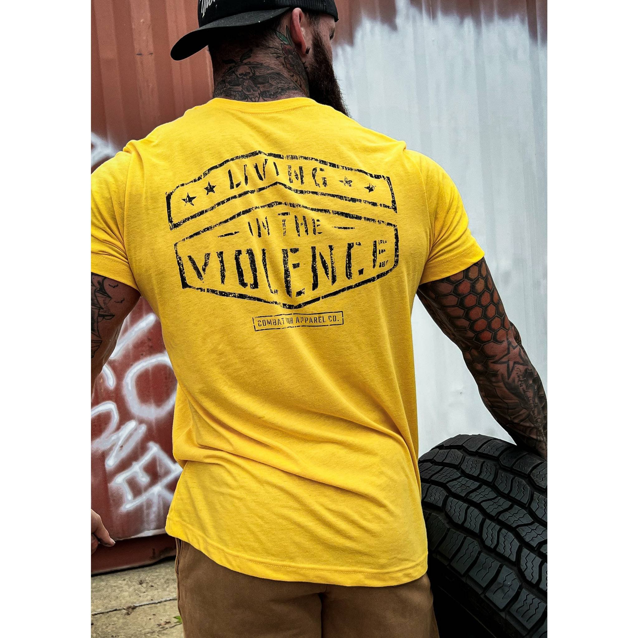 Men’s t-shirt with the words “Living in the violence” #color_yellow