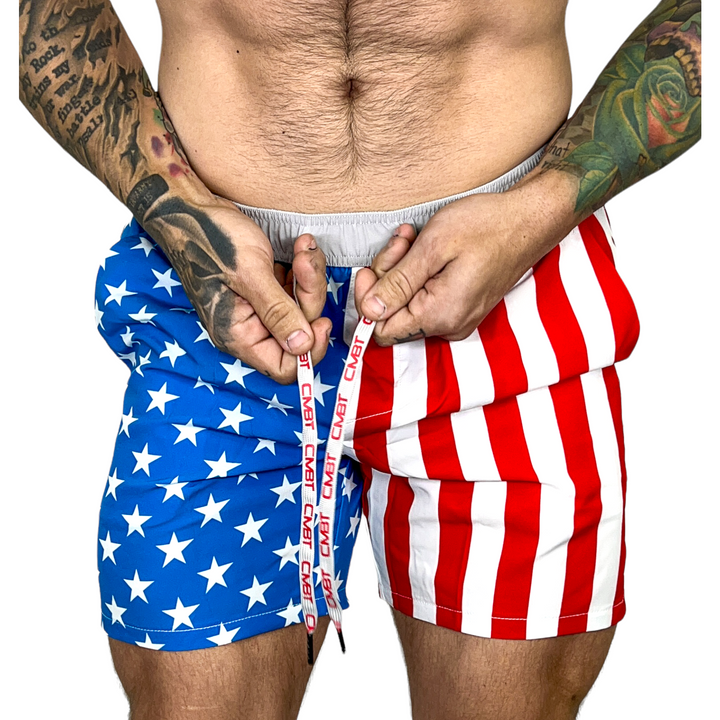 Men’s hybrid training and swim shorts with skulls, pineapples, and flowers #color_american-flag