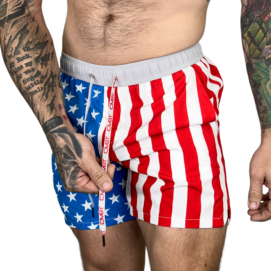 Men’s hybrid training and swim shorts with skulls, pineapples, and flowers #color_american-flag