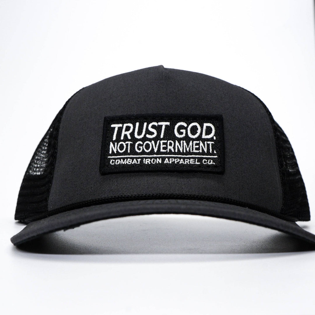 A retro rope snapback with a patch that says “Trust god. Not government” #color_gun-metal-gray-black