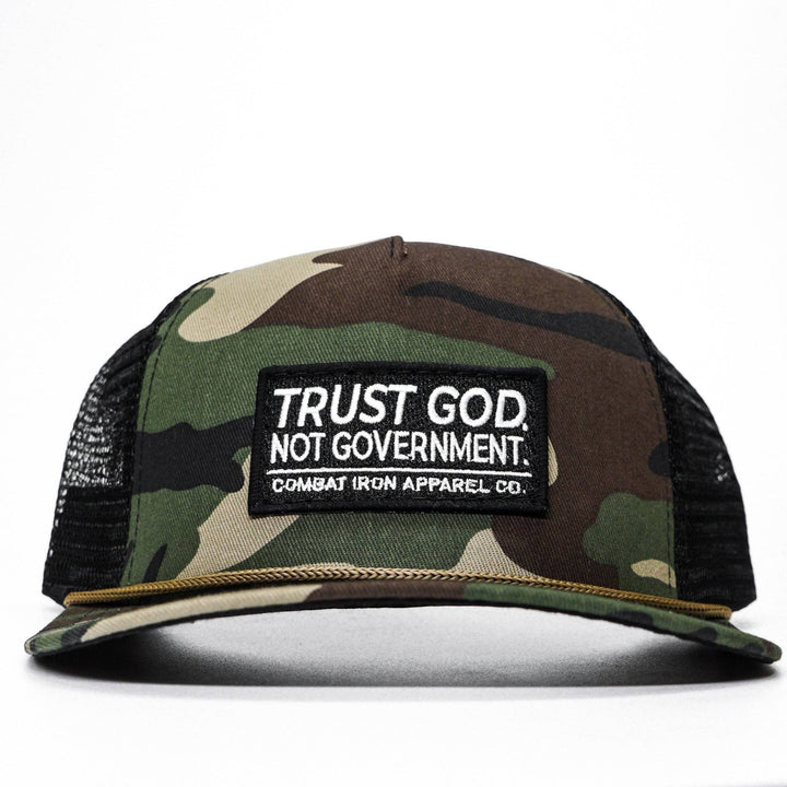 A camo retro rope snapback with a patch that says “Trust god. Not government” #color_bdu-camo-black