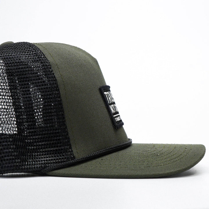 A retro rope snapback with a patch that says “Trust god. Not government” #color_military-green-black
