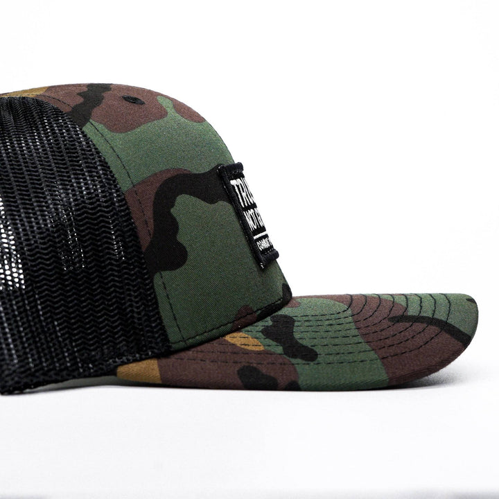 A mid-profile mesh snapback with the words “Trust God. Not government.” in white on the front #color_bdu-camo-black