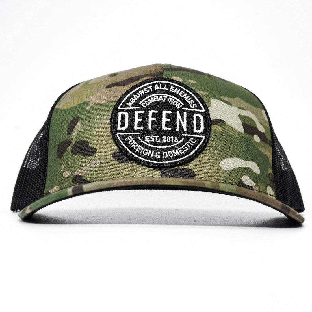 A camo retro rope snapback with the words “Defend against all enemies, foreign & domestic” on the front #color_multicam-black