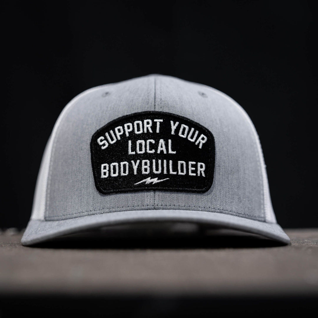 mid-profile mesh snapback with a patch that reads “Support your local bodybuilder” #color_gray-white