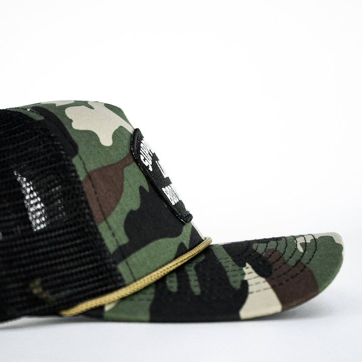 A camo retro rope snapback with a black and white patch saying “Support your local bodybuilder” #color_bdu-camo-black