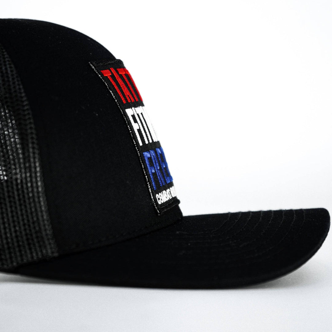 A black mid-profile mesh snapback with a print that says “Tattoos, fitness & freedom” #color_black-black