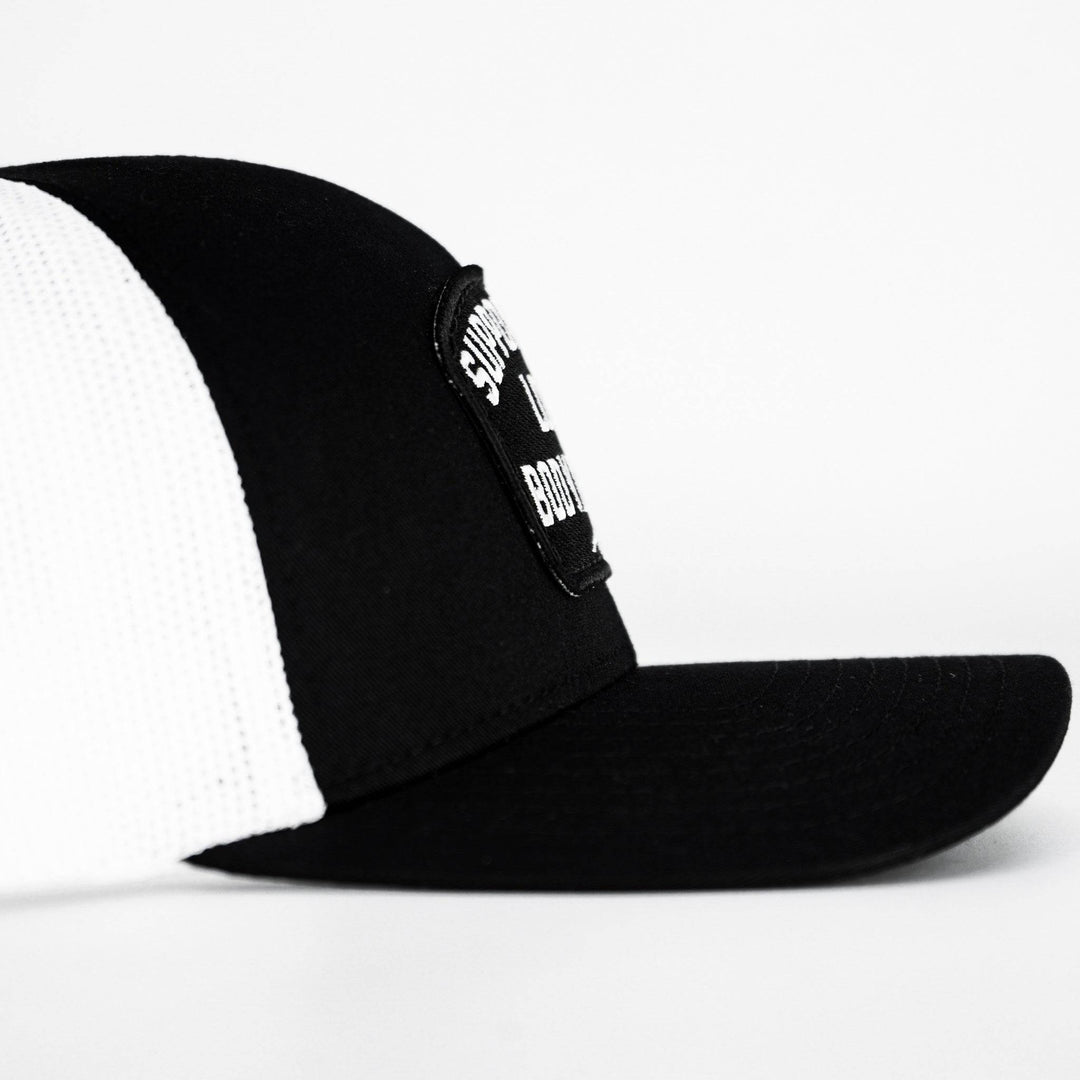 A black and white mid-profile mesh snapback with a patch that reads “Support your local bodybuilder” #color_black-white