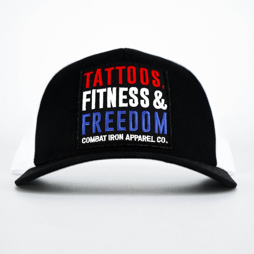 A black mid-profile mesh snapback with a print that says “Tattoos, fitness & freedom” #color_black-white