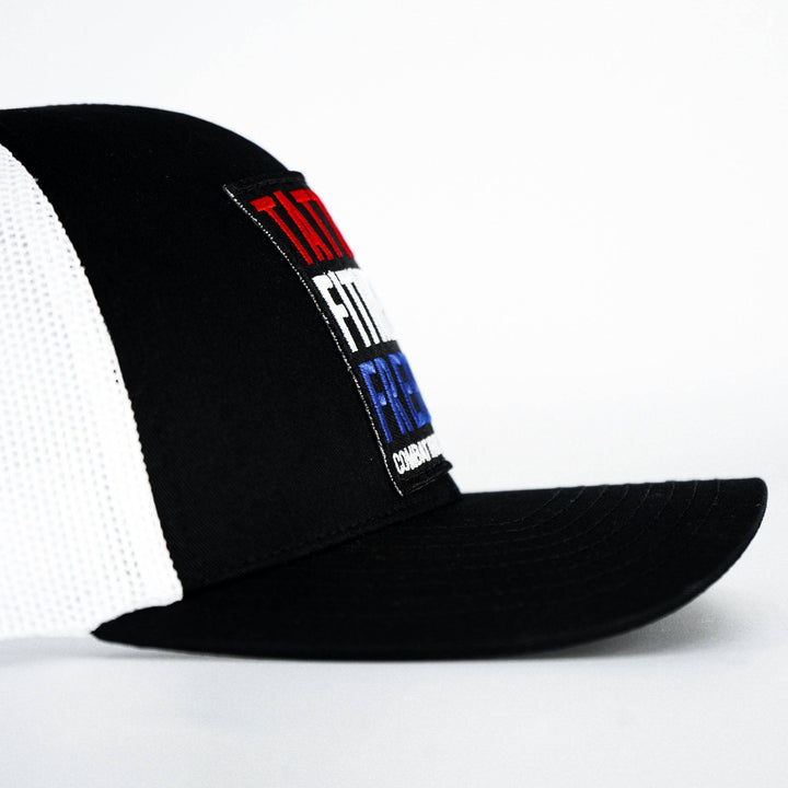 A black mid-profile mesh snapback with a print that says “Tattoos, fitness & freedom” #color_black-white
