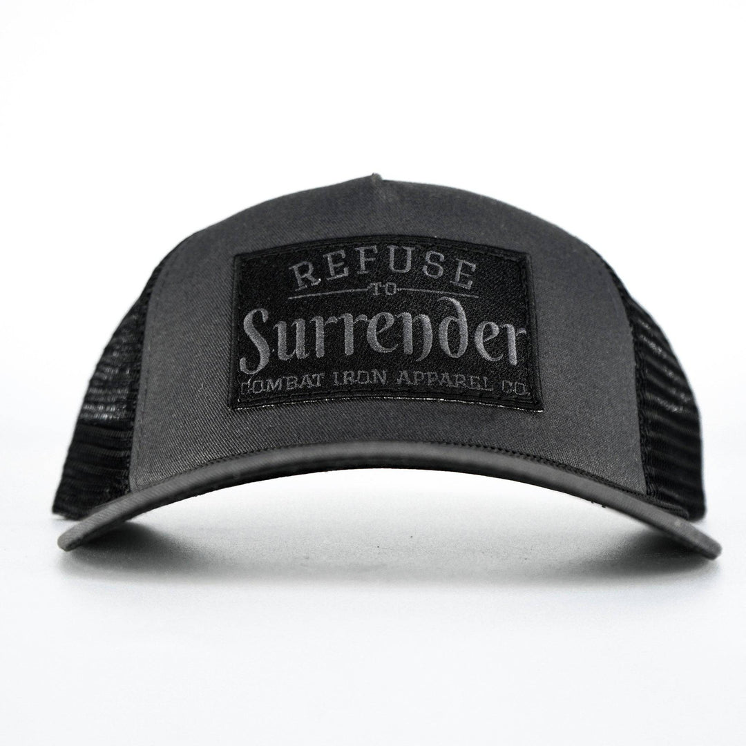 A camo retro rope snapback with a black patch that says “Refuse to surrender” #color_gun-metal-gray-black