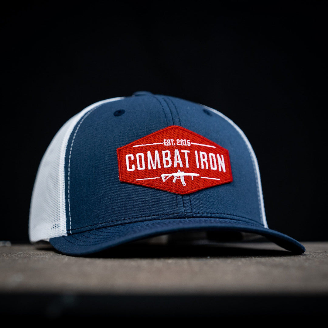 Combat branded patch mid-profile mesh snapback with a black and white patch on the front #color_navy-white