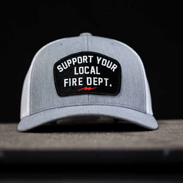 A mid-profile mesh snapback with the patch that says “Support your local fire dept.”  #color_gray-white