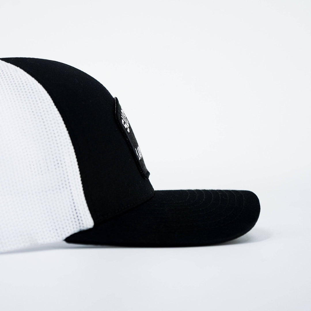 A black mid-profile snapback hat with a patch on the front that says “Support your local law enforcement” #color_black-white