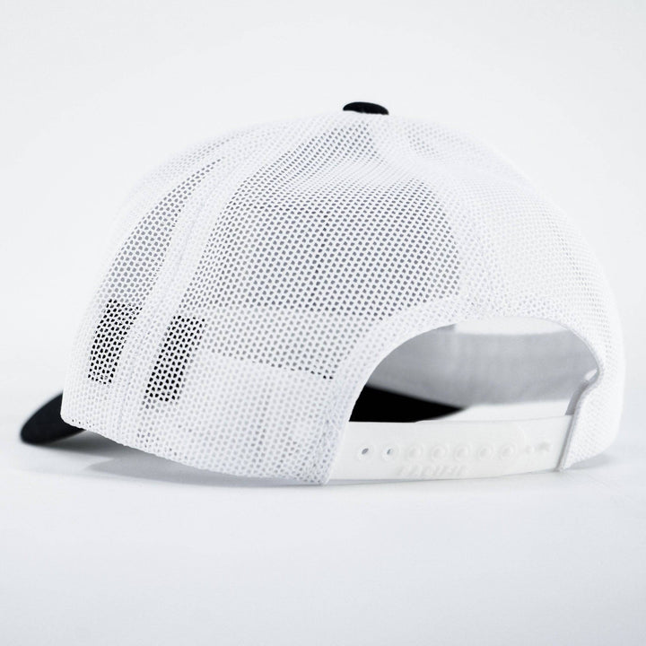 A mid-profile mesh snapback hat with a “Pew pew lifestyle” patch on the front #color_black-white