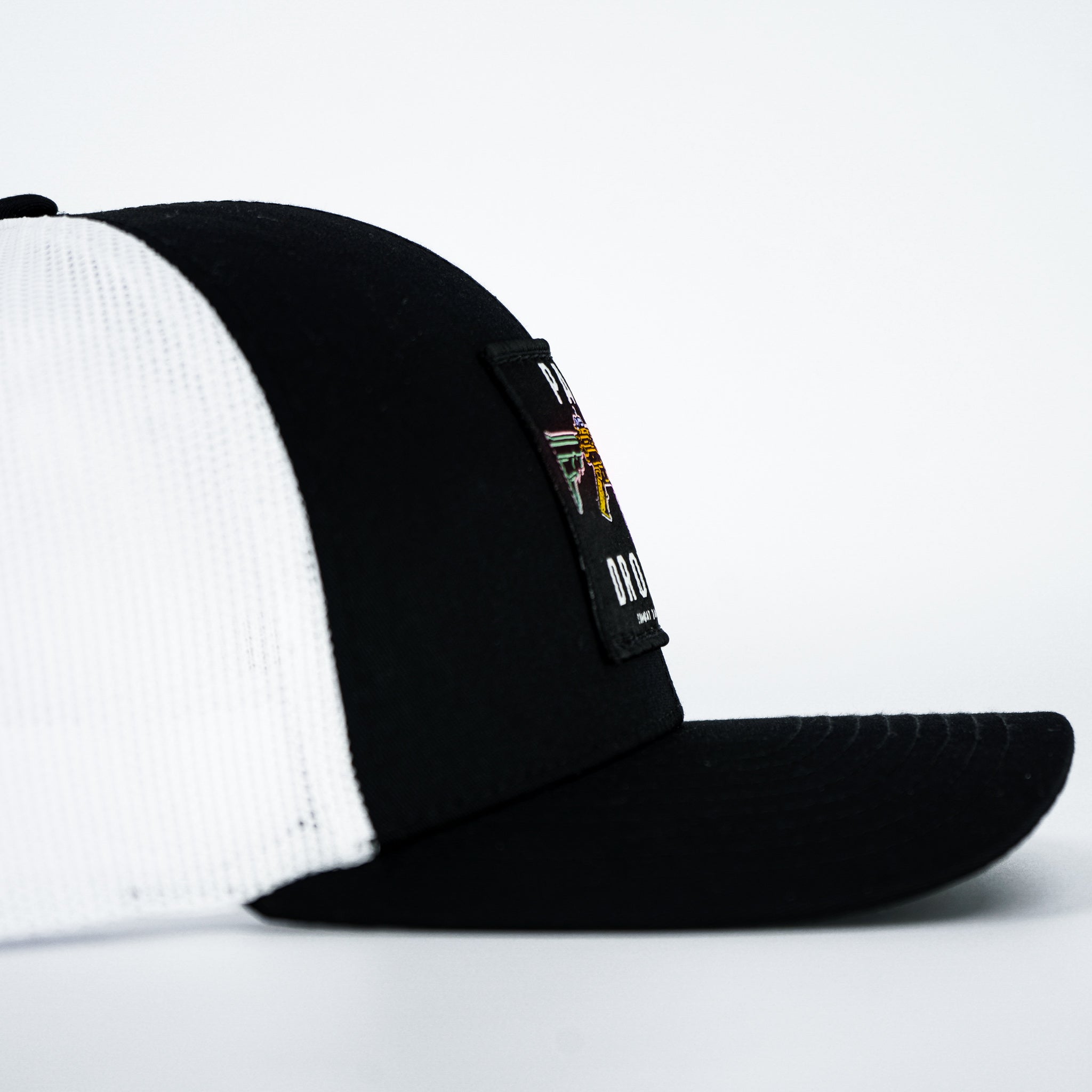 Panty dropper mid-profile mesh snapback hat in all black with a colorful patch #color_black-white