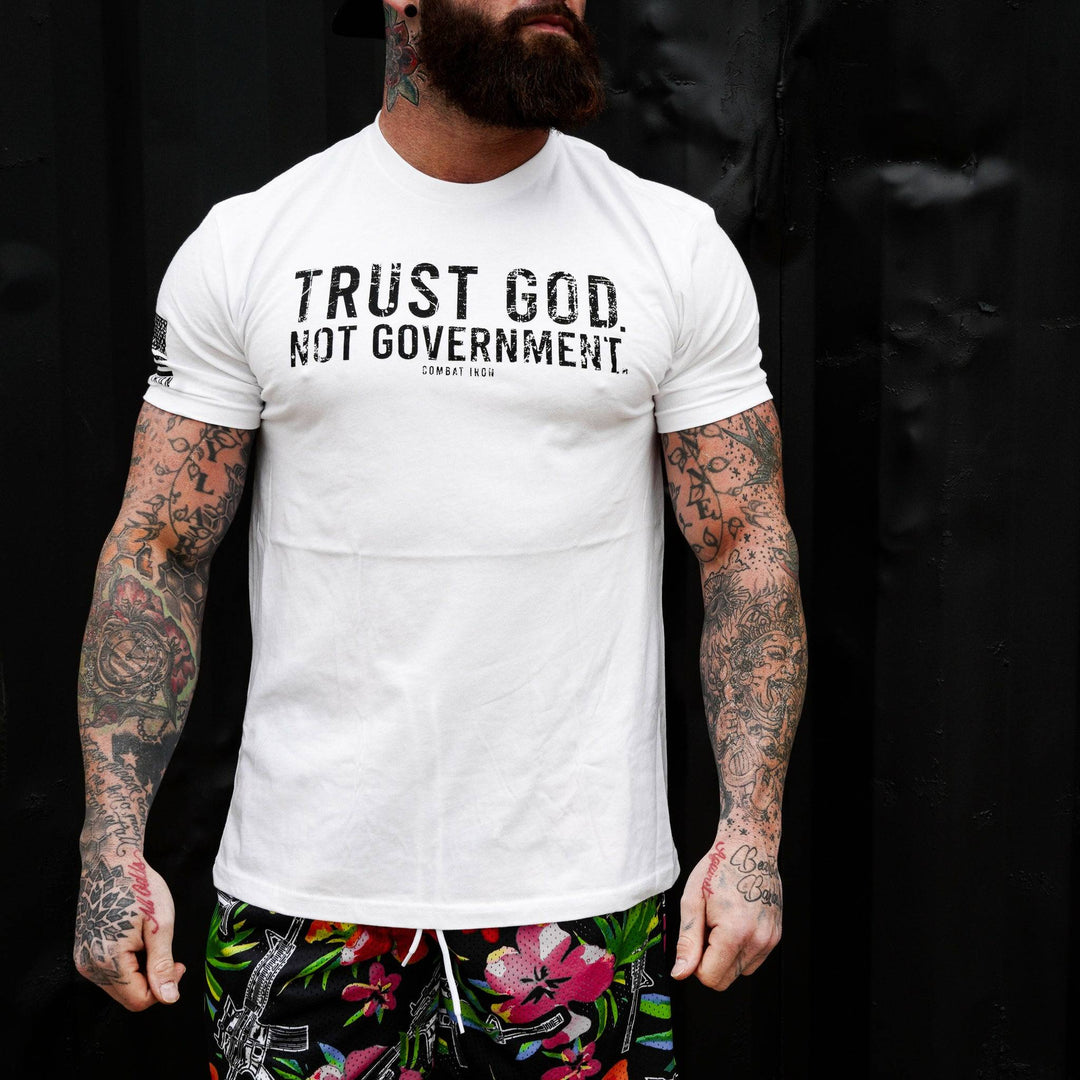 Men’s black t-shirt with the message “Trust God. Not government.” with letters and a American flag on the sleeve #color_white