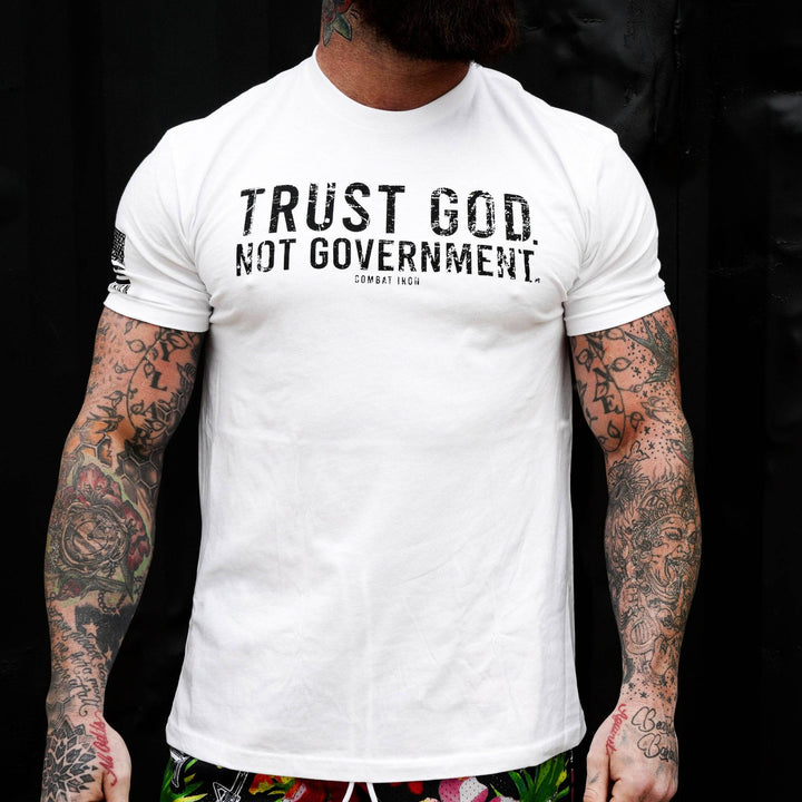 Men’s black t-shirt with the message “Trust God. Not government.” with letters and a American flag on the sleeve #color_white