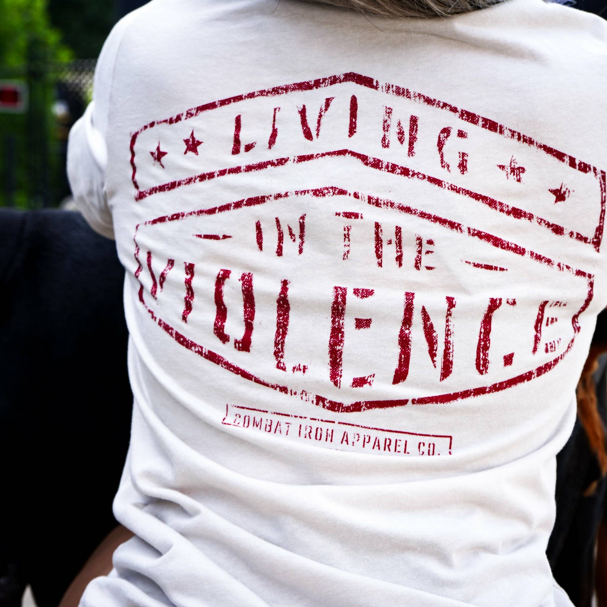 Men’s t-shirt with the words “Living in the violence” #color_tan